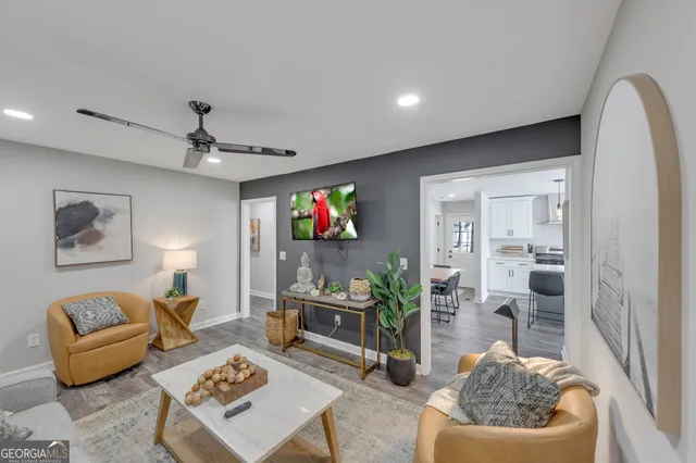 a living room with furniture and a flat screen tv