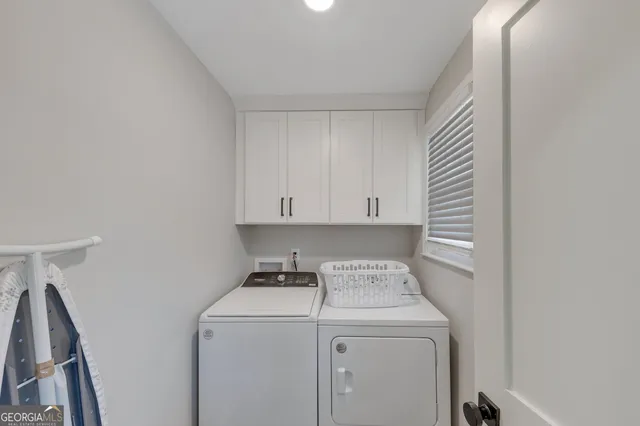 a utility room with dryer and washer