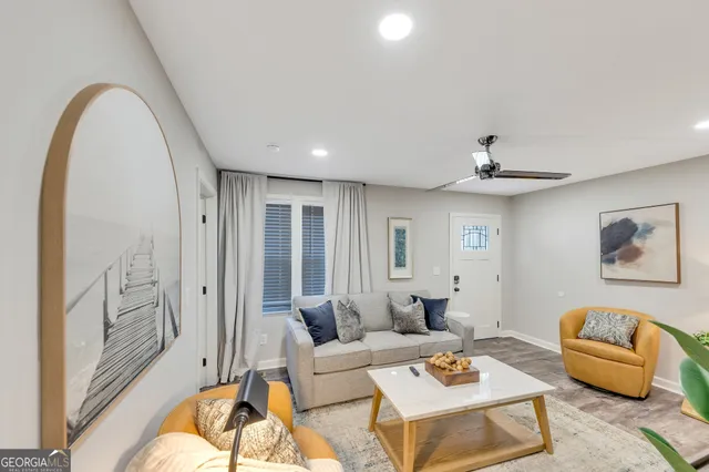 a living room with furniture and a large window