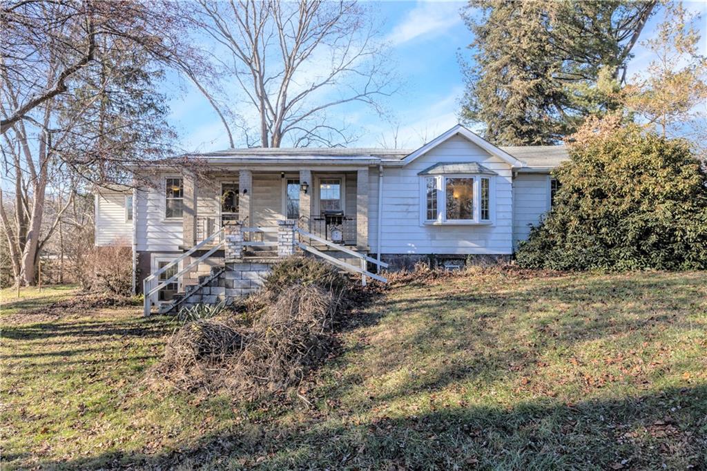 4267 Glen Eden Road Cranberry Township, PA 16066 - Photo 1 of 25 a front view of a house with garden