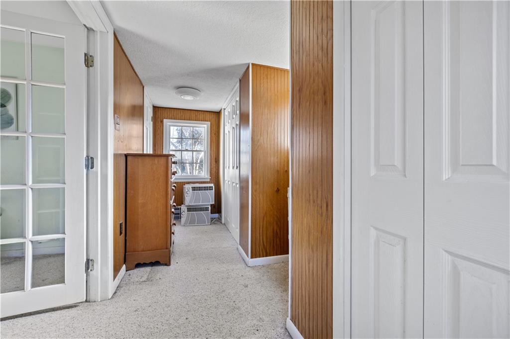 4267 Glen Eden Road Cranberry Township, PA 16066 - Photo 17 of 25 a view of a hallway with wooden shelves