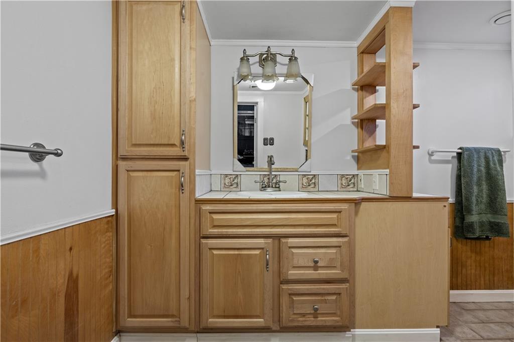 4267 Glen Eden Road Cranberry Township, PA 16066 - Photo 21 of 25 a bathroom with a sink and a mirror