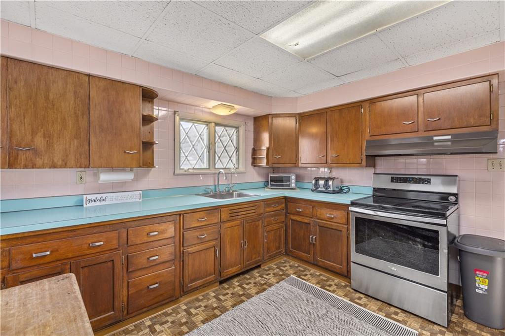 4267 Glen Eden Road Cranberry Township, PA 16066 - Photo 5 of 25 a kitchen with sink cabinets and window