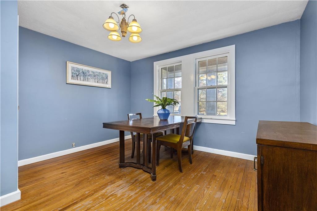 4267 Glen Eden Road Cranberry Township, PA 16066 - Photo 7 of 25 a view of a dining room with furniture and wooden floor