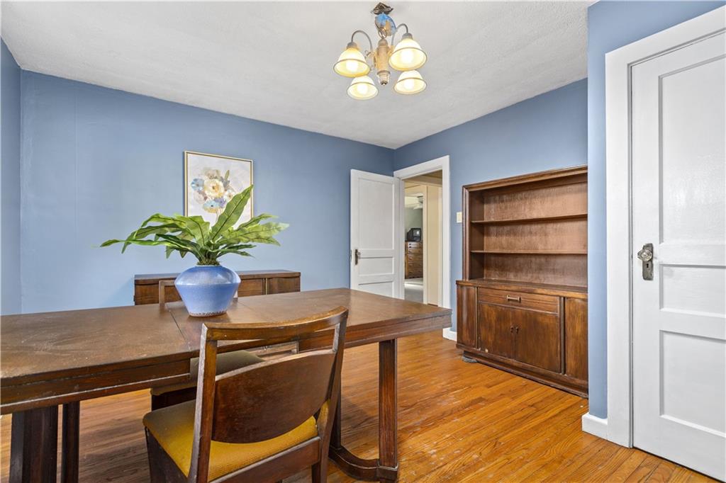 4267 Glen Eden Road Cranberry Township, PA 16066 - Photo 8 of 25 a dining room filled chandelier and wooden floor