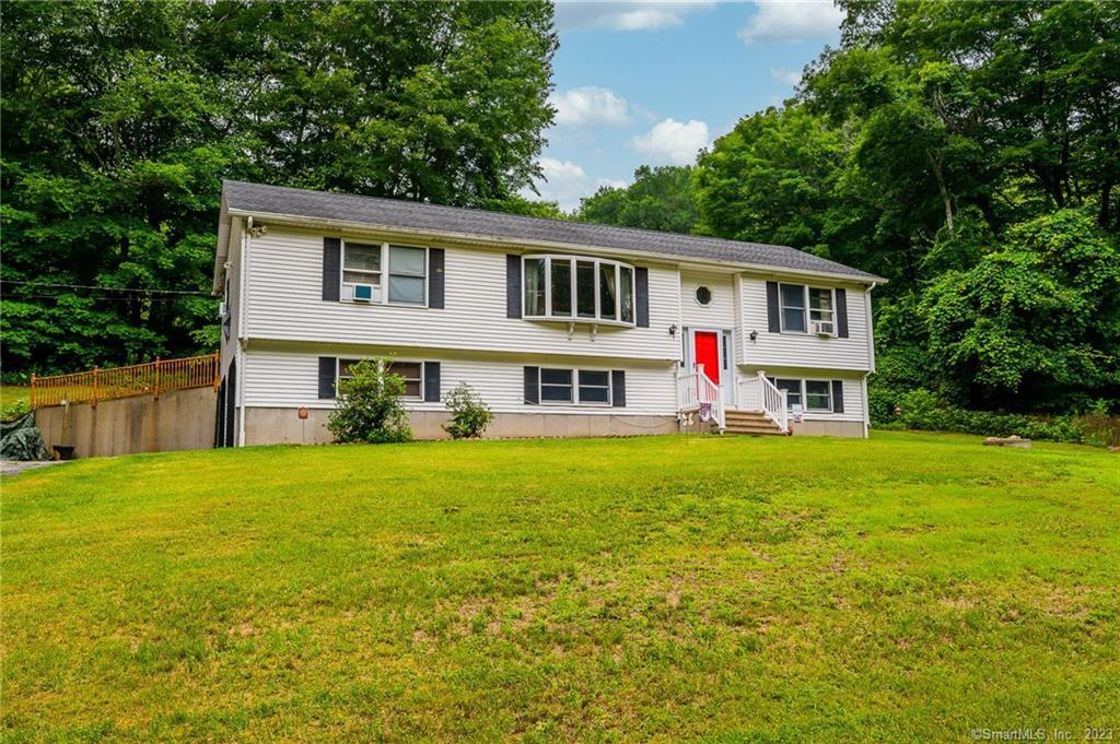 67 Town Farm Road Ledyard, CT 06339 - Photo 1 of 1 a front view of house with yard and trees
