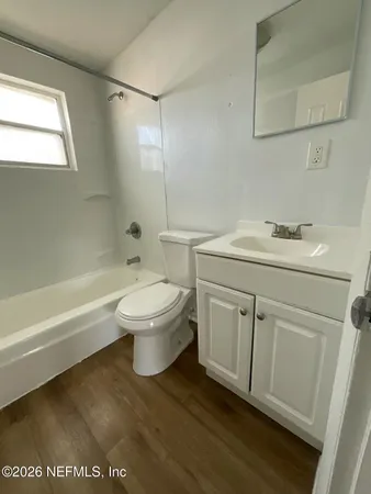 a bathroom with a sink a toilet and a bathtub