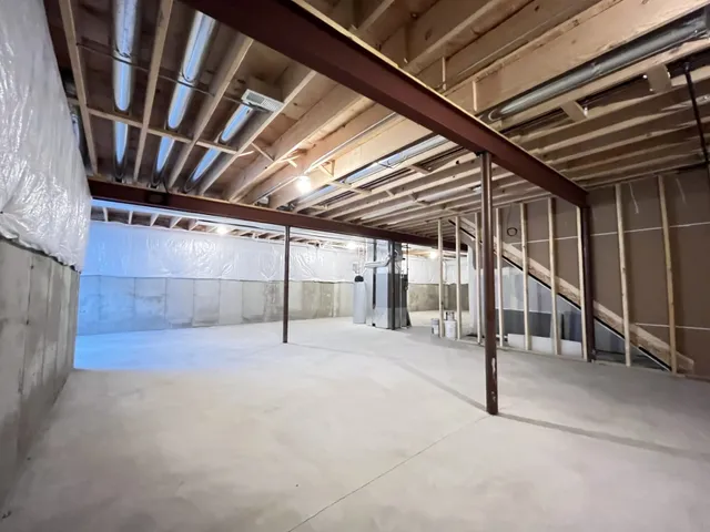 a view of an empty room with stairs