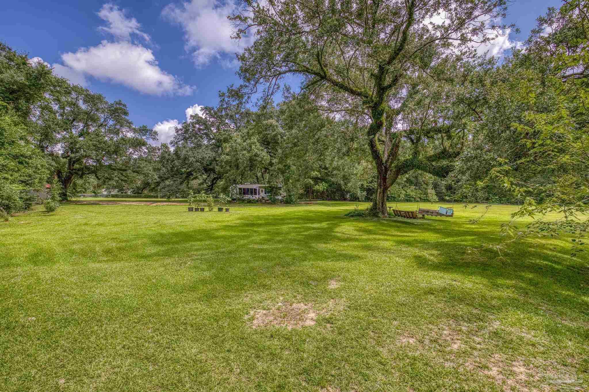 2345 Pompano Street Cantonment, FL 32533 - Photo 12 of 48 a view of field with trees
