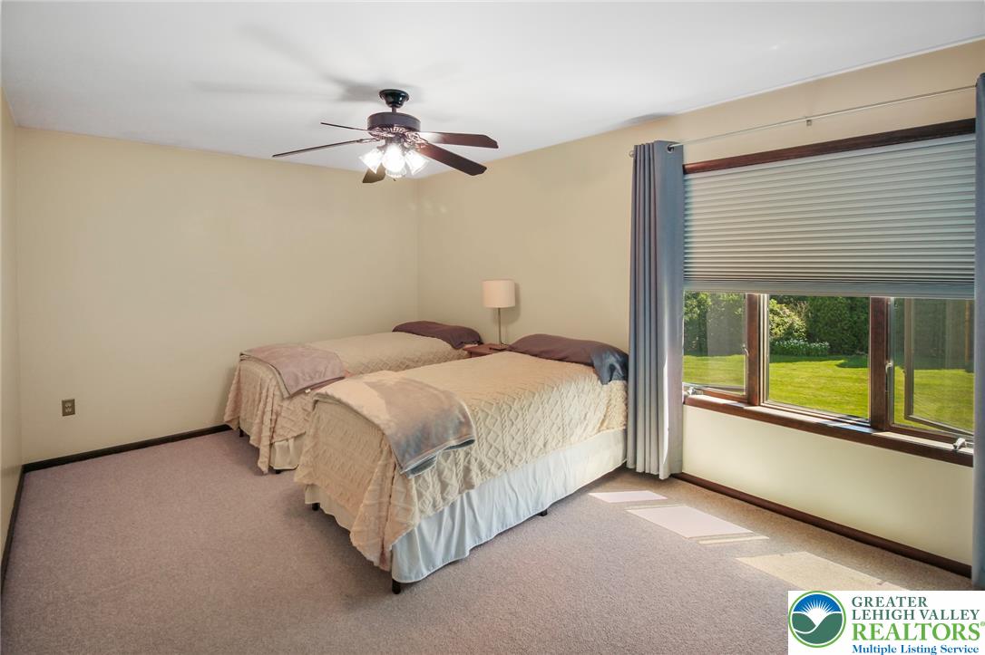 3470 Brodhead Road Bethlehem, PA 18020 - Photo 62 of 84 Carpeted bedroom with a window overlooking a lush yard.