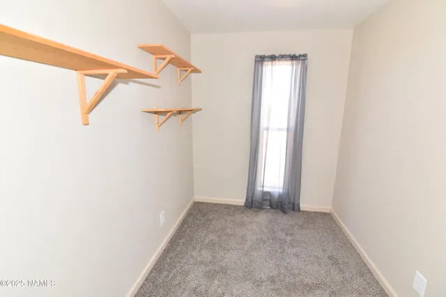 a view of room with stairs and a window