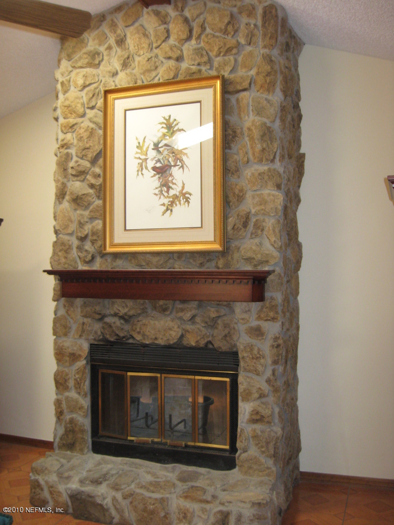 4854 Latimer Road South Jacksonville, FL 32257 - Photo 11 of 15 a white building with a fireplace