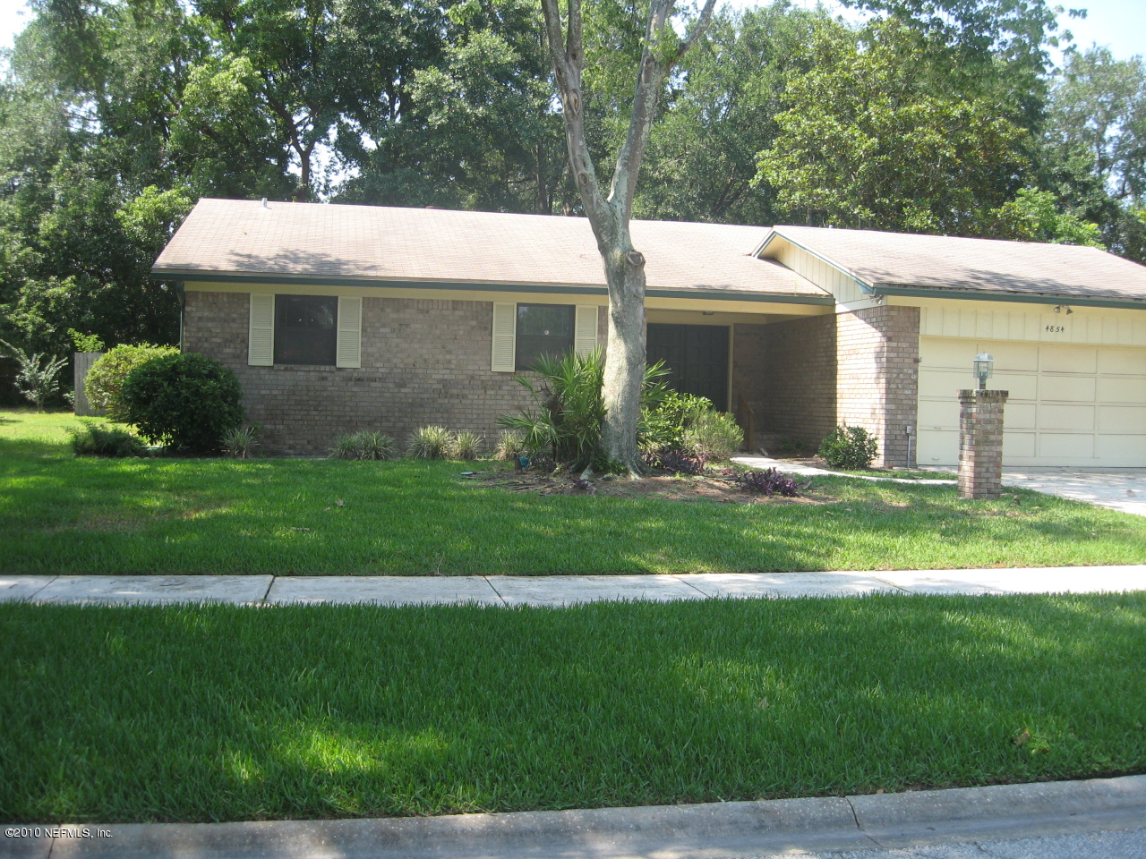4854 Latimer Road South Jacksonville, FL 32257 - Photo 2 of 15 a view of a white house with a yard