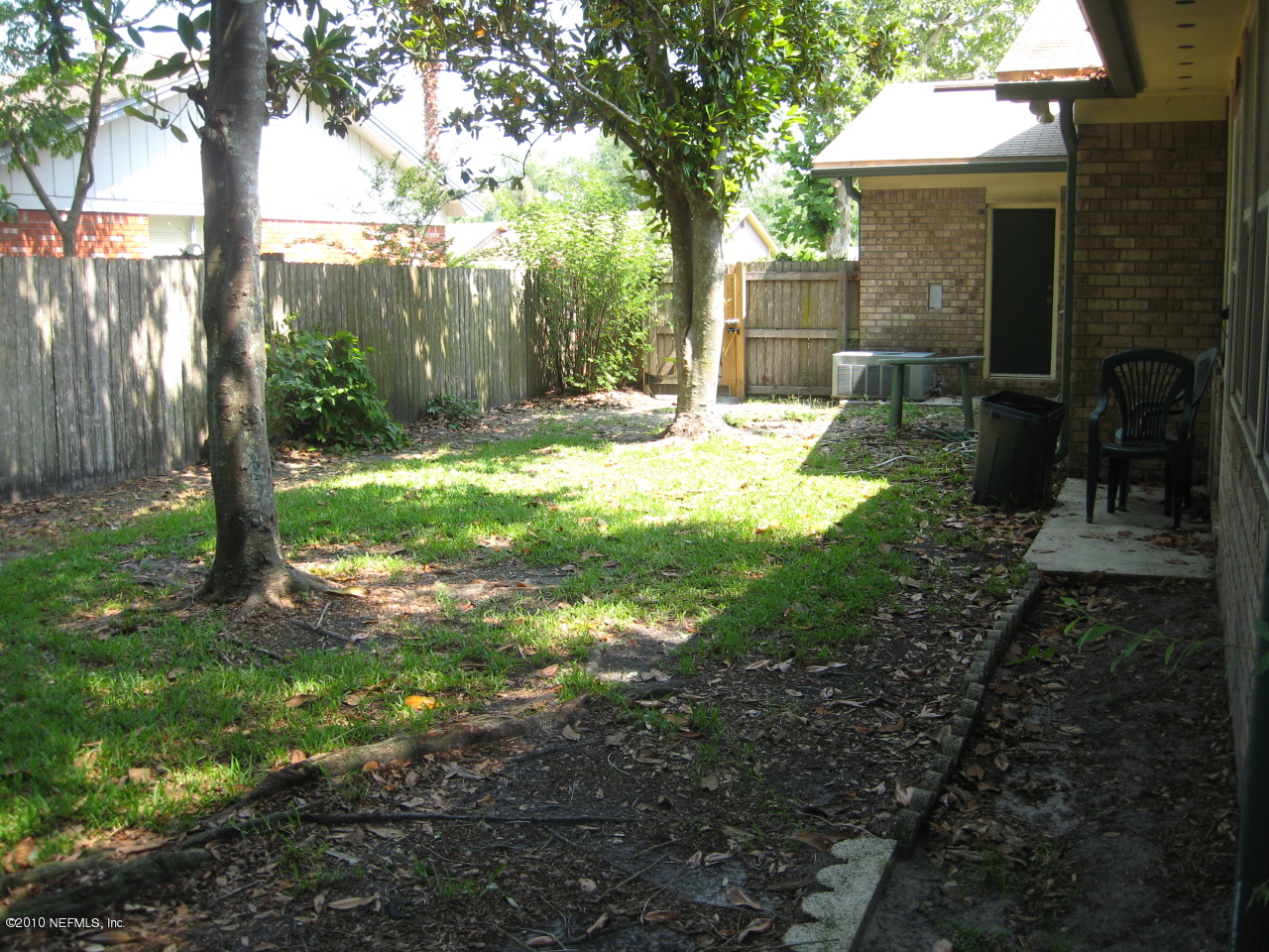 4854 Latimer Road South Jacksonville, FL 32257 - Photo 10 of 15 a view of a yard with plants and a large tree