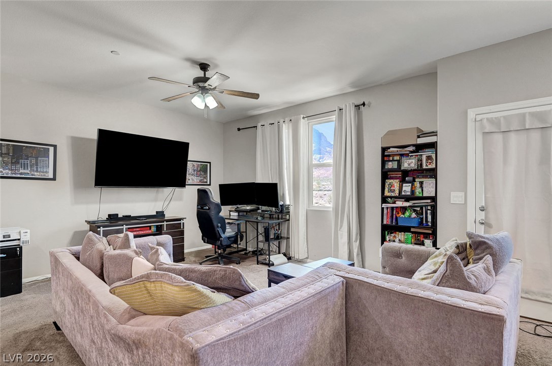 1285 Raritan Place Henderson, NV 89002 - Photo 4 of 20 Plentiful natural light fills a versatile secondary living area complete with neutral wall tones.