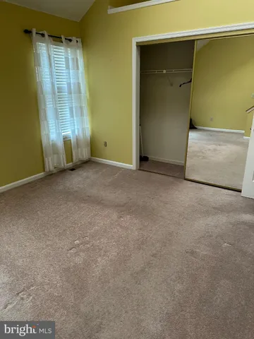 an empty room with staircase