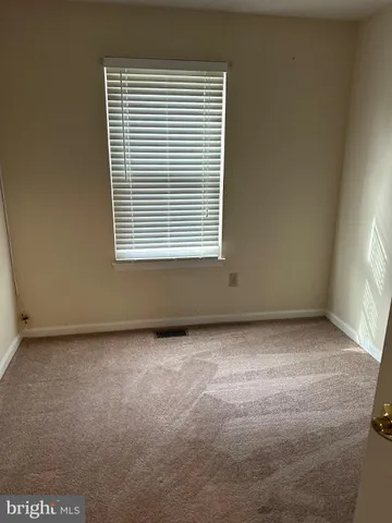 a view of a room that has a window in it