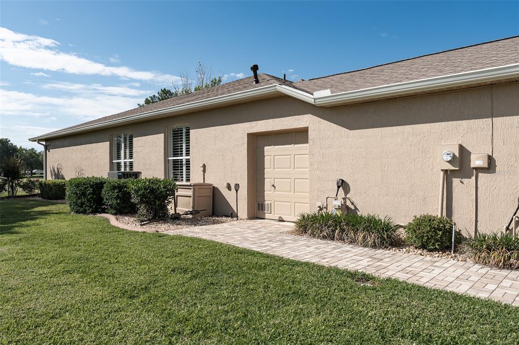 15525 Southwest 14th Avenue Road Ocala, FL 34473 - Photo 57 of 75 a view of a backyard with plants and a bench