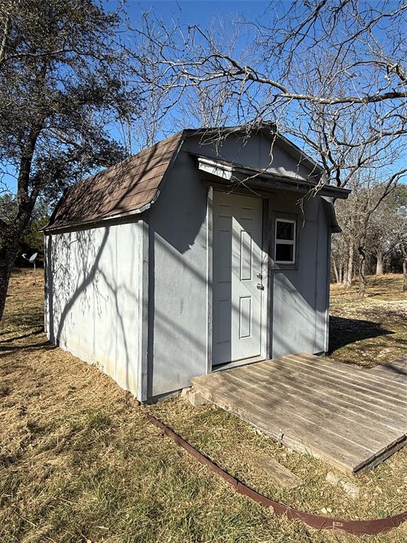 729 County Road 1304 Morgan, TX 76671 - Photo 14 of 32 a view of a house with a snow in the yard