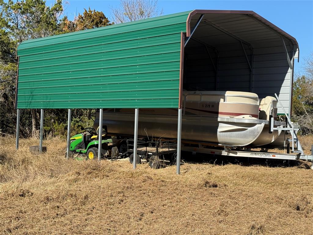 729 County Road 1304 Morgan, TX 76671 - Photo 21 of 32 a view of a two chair under an umbrella