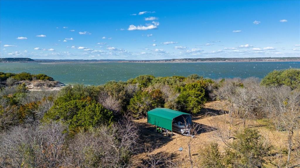 729 County Road 1304 Morgan, TX 76671 - Photo 25 of 32 a view of a lake with a mountain in the background