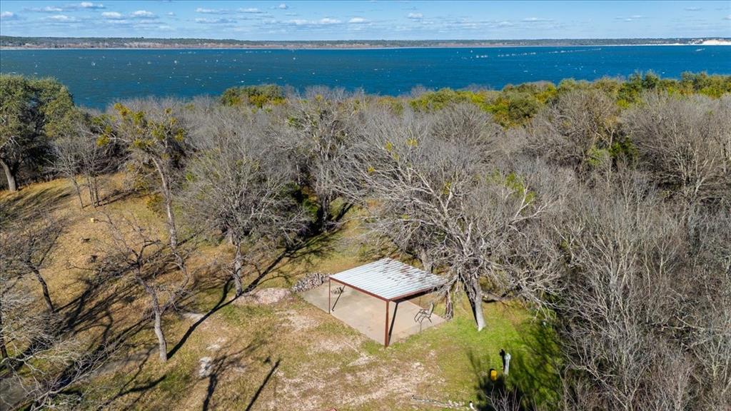 729 County Road 1304 Morgan, TX 76671 - Photo 27 of 32 a view of a lake with a yard
