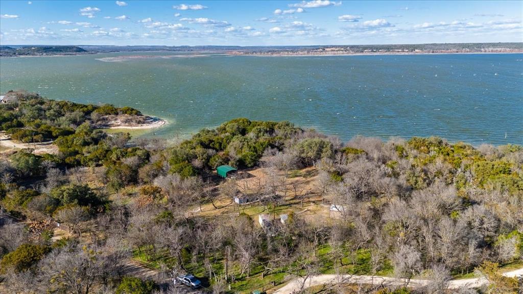 729 County Road 1304 Morgan, TX 76671 - Photo 30 of 32 a view of a lake from a yard