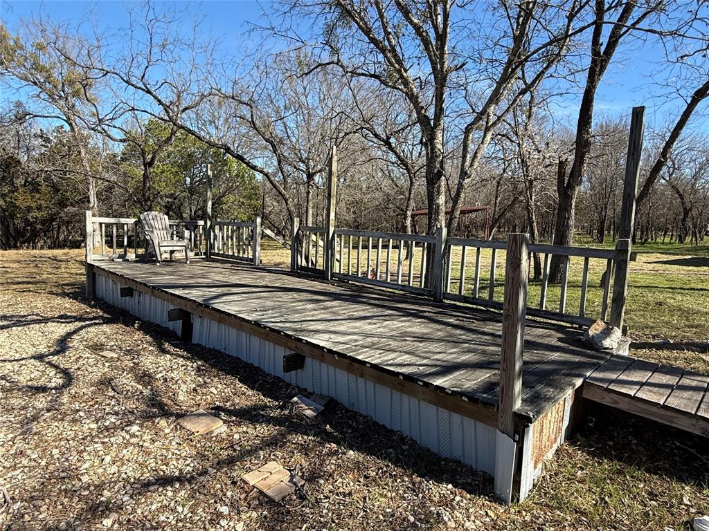729 County Road 1304 Morgan, TX 76671 - Photo 9 of 32 a view of a yard with wooden fence