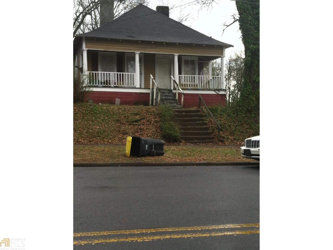 14 East 9th Street Southeast Rome, GA 30161 - Photo 1 of 1 a front view of a house with yard