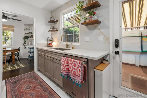 a kitchen view with table and chairs