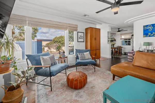 a living room with furniture and a large window