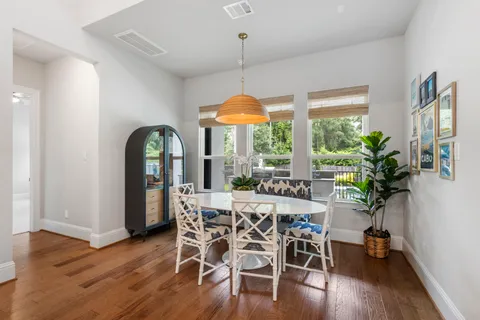 a spacious bedroom with a bed couch tv and a window