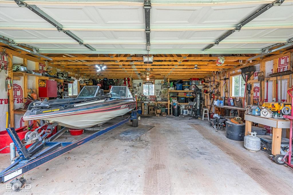 236 Charlie Cannon Road Coushatta, LA 71019 - Photo 11 of 39 Garage with a workshop area