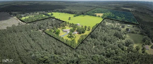 view of a pool with a yard