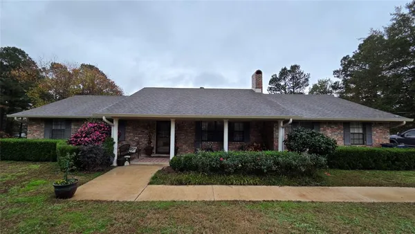 a front view of a house with yard