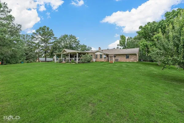 a view of a house with a big yard