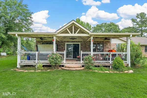 a front view of a house with garden and porch