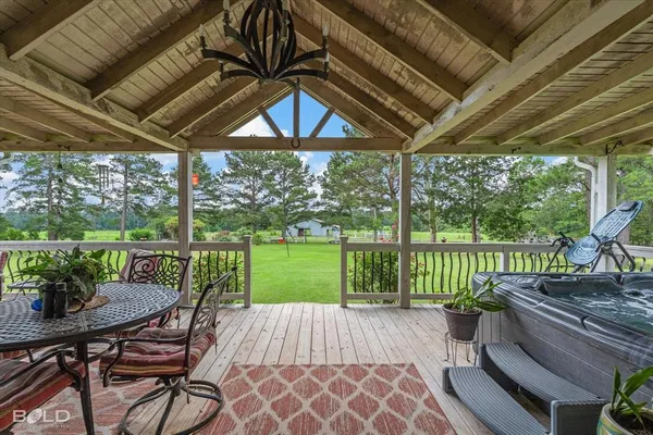 a view of a patio with a table chairs and a table