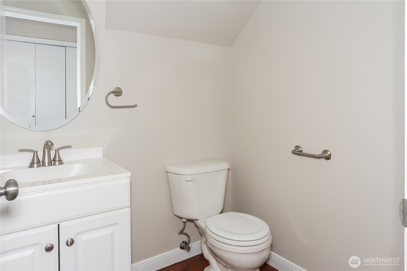 9002 161st Street East Puyallup, WA 98375 - Photo 13 of 17 a bathroom with a sink a toilet and a mirror