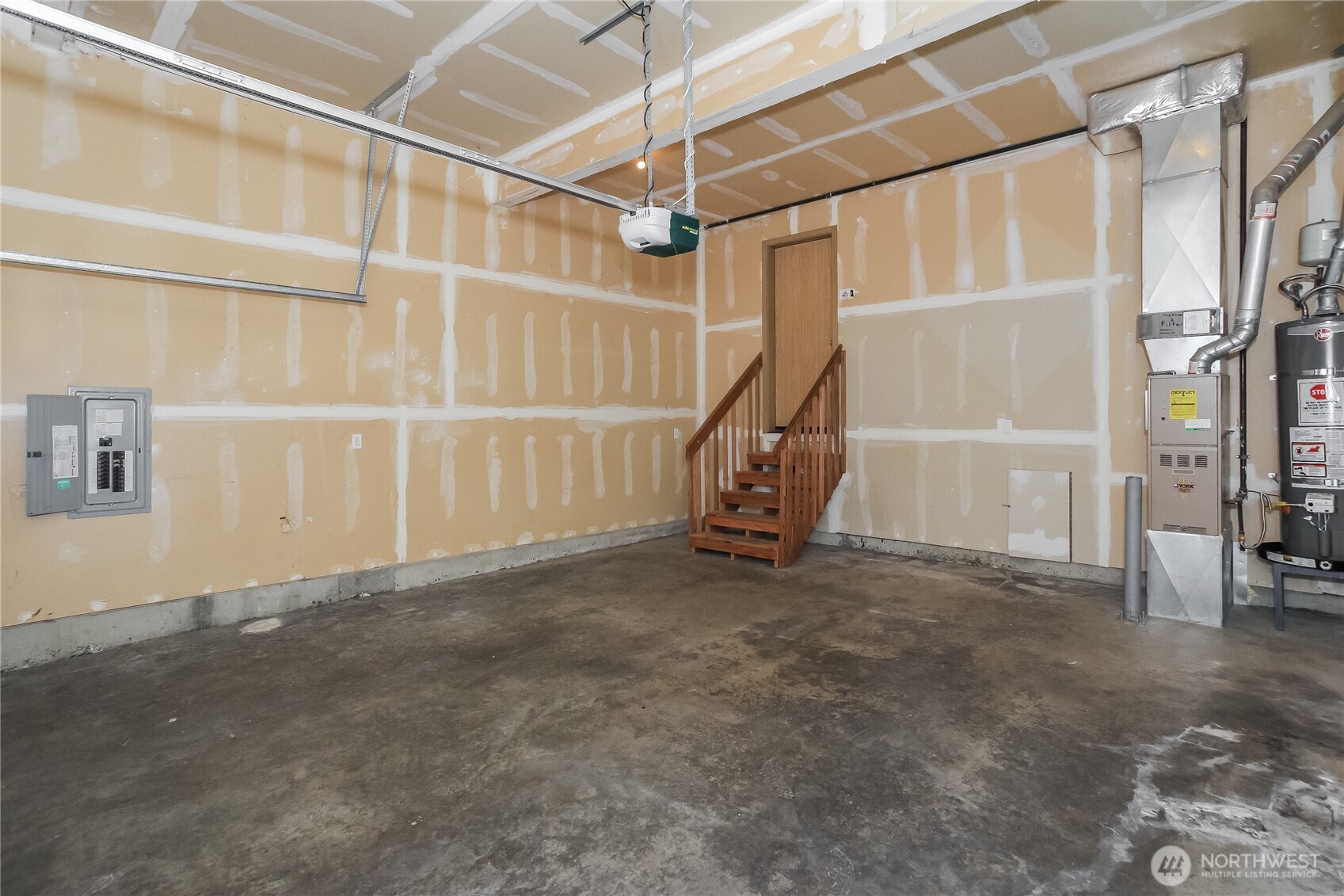 9002 161st Street East Puyallup, WA 98375 - Photo 14 of 17 a view of a room with wooden floor and windows