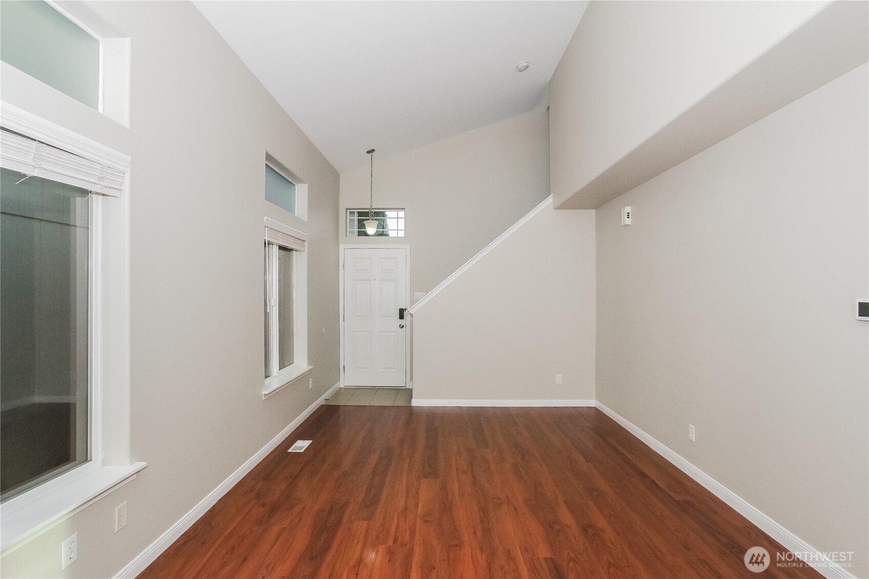 9002 161st Street East Puyallup, WA 98375 - Photo 3 of 17 a view of a room with wooden floor and window