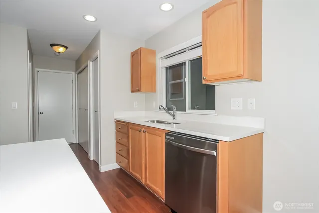 a spacious bathroom with a sink and a mirror