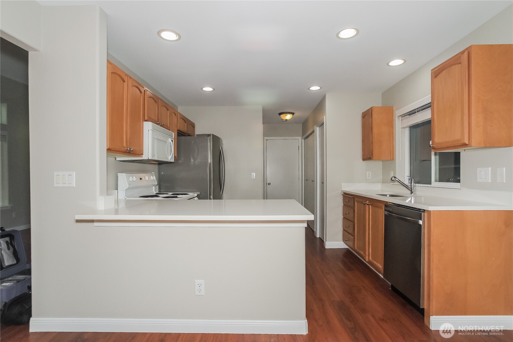 9002 161st Street East Puyallup, WA 98375 - Photo 7 of 17 a large kitchen with stainless steel appliances