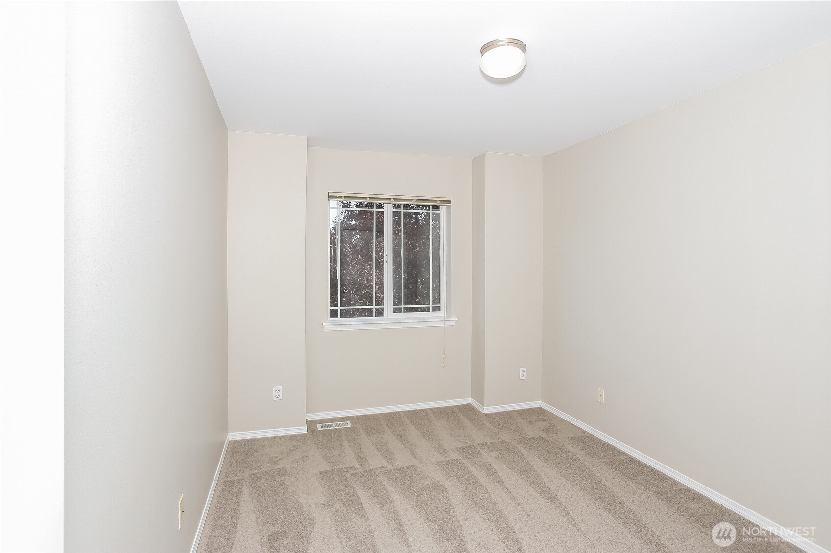 9002 161st Street East Puyallup, WA 98375 - Photo 9 of 17 a view of an empty room with a window