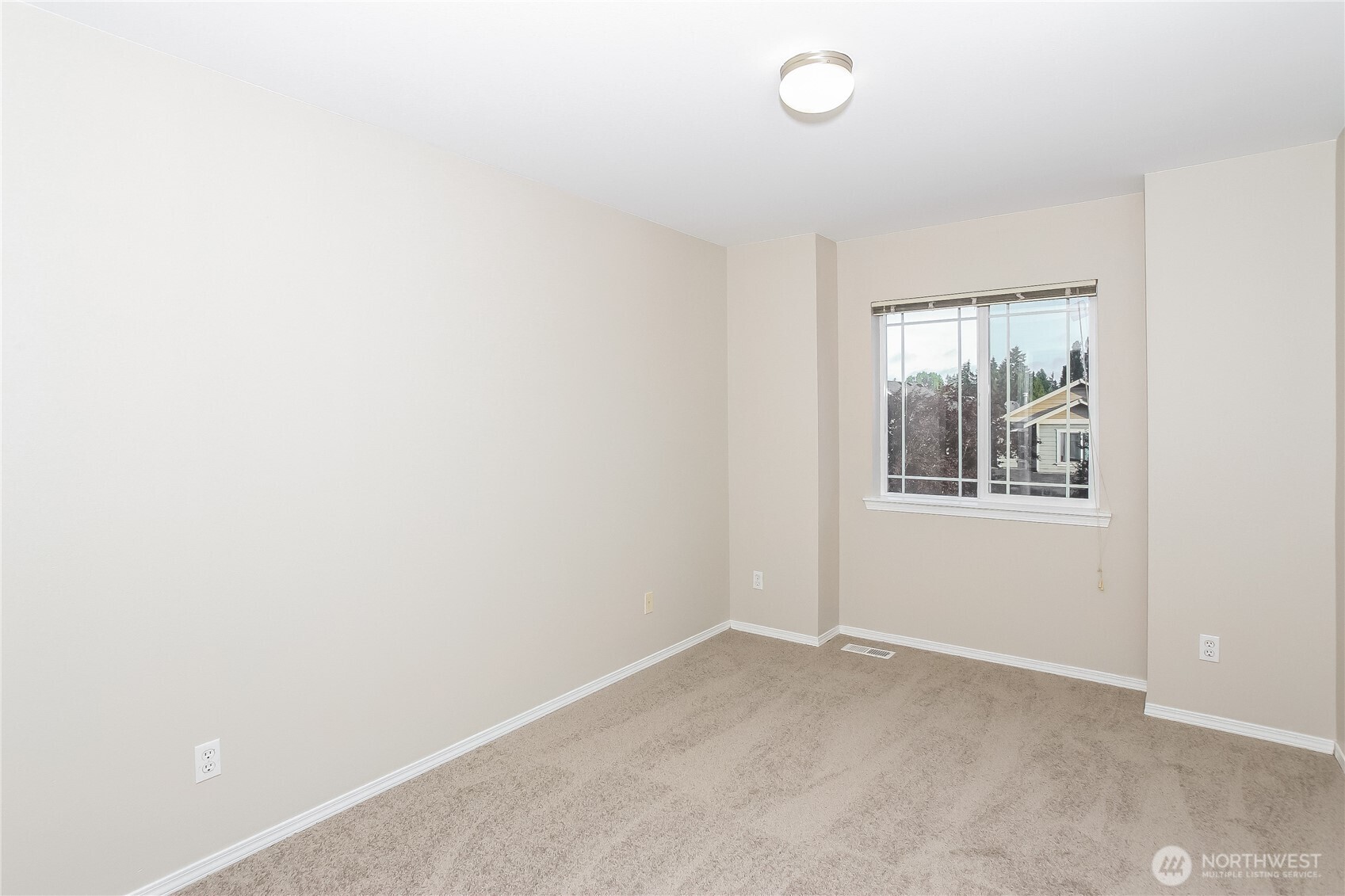 9002 161st Street East Puyallup, WA 98375 - Photo 10 of 17 a view of an empty room with a window