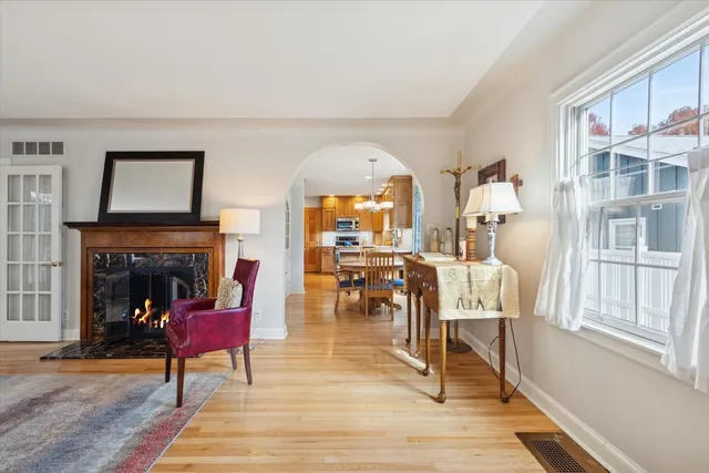 a view of a dining room with furniture wooden floor and chandelier