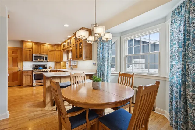 a view of a dining room with furniture window and wooden floor