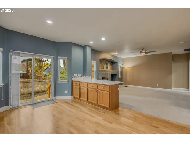 a kitchen with stainless steel appliances granite countertop a sink and cabinets