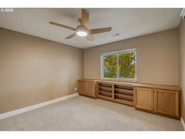 a bathroom with a sink toilet double vanity and shower