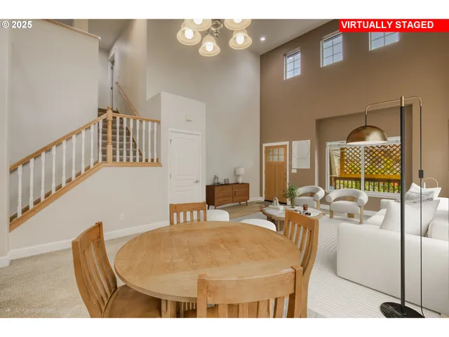 a living room with furniture a table and chairs
